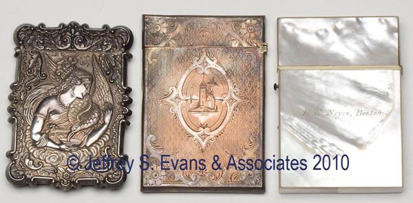 THREE ASSORTED CALLING CARD CASES: THREE ASSORTED CALLING CARD CASES, comprised of a mother-of-pearl and ivory example engraved "F. E. Noyes, Boston", an ornate repousse silver-like example with no hallmarks found, and an engraved silv