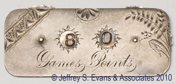 STERLING SILVER GAME COUNTER: STERLING SILVER GAME COUNTER, rectangular with rounded corners, front with bright cut decoration, two moveable discs each with 0 to 9, engraved "Games Points", reverse monogrammed and hallmarked, poss