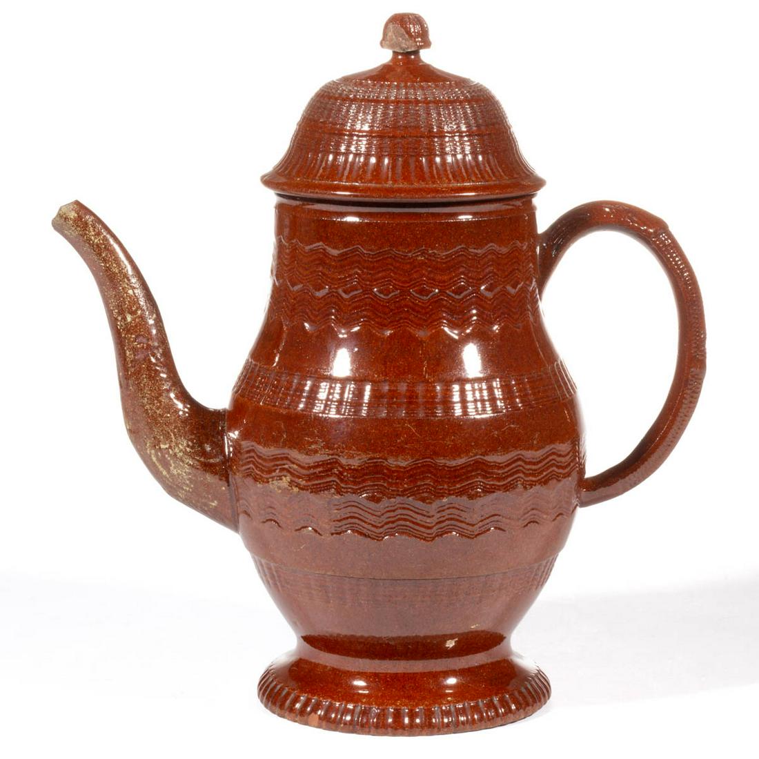 AMERICAN / BRITISH REFINED REDWARE ENGINE-TURNED COFFEE: AMERICAN / BRITISH REFINED REDWARE ENGINE-TURNED COFFEE POT, lead-glazed, of large baluster form with domed turned cover, featuring four bands of ribbed decoration to body and handle with foliate and