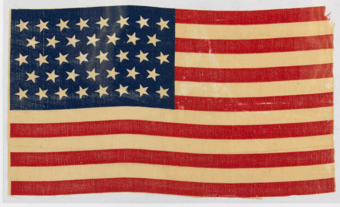 38-STAR AMERICAN NATIONAL COLORADO STATEHOOD PARADE: 38-STAR AMERICAN NATIONAL COLORADO STATEHOOD PARADE FLAG, printed cotton, a vibrant example retaining strong color, the blue canton featuring stars arranged in an 8-7 pattern, 13 stripes. Unframed. Ci