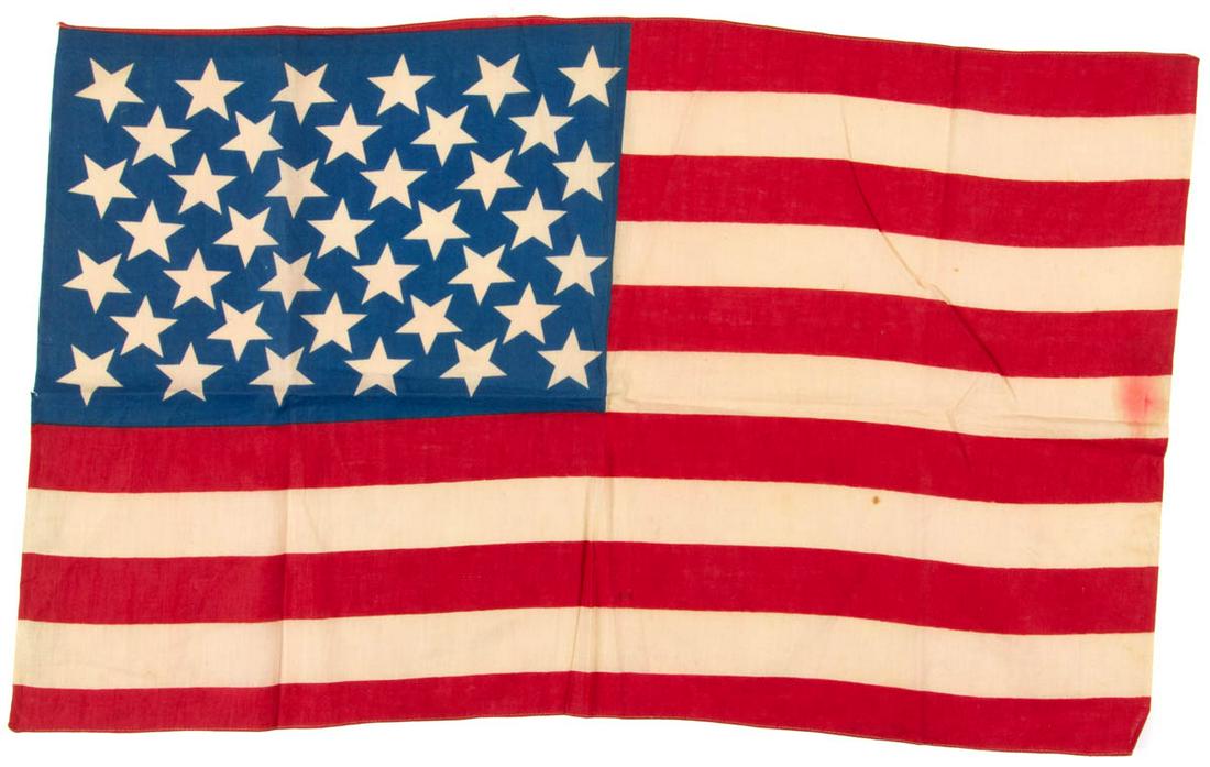39-STAR AMERICAN NATIONAL PRINTED PARADE FLAG: 39-STAR AMERICAN NATIONAL PRINTED PARADE FLAG, cotton, a fine example, the blue canton featuring unusual diagonal pattern, 13 stripes, machine-stitched hem to upper and lower edges Unframed. Circa 188