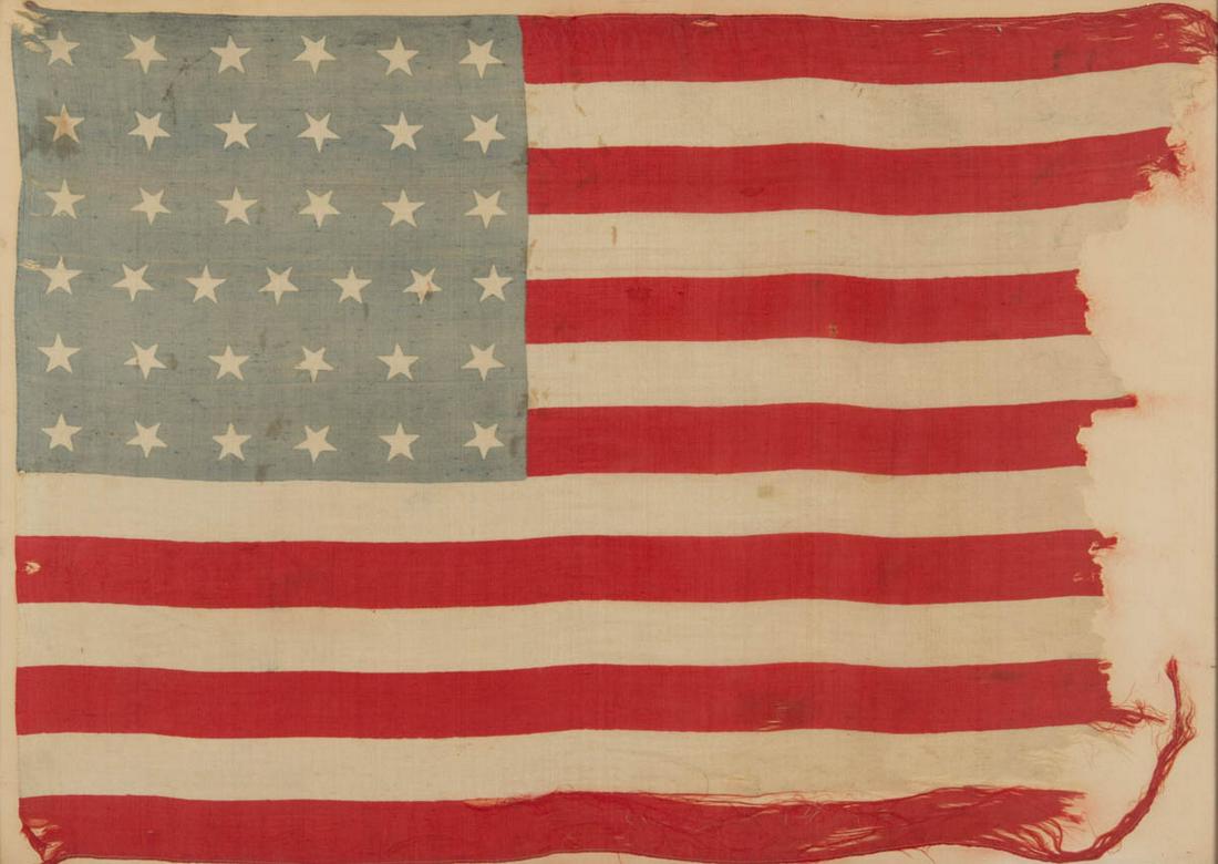 37-STAR AMERICAN NATIONAL NEBRASKA STATEHOOD PARADE: 37-STAR AMERICAN NATIONAL NEBRASKA STATEHOOD PARADE FLAG, printed silk, machine-sewn throughout, the light blue canton featuring six rows of five-pointed stars, fly with 13 red and white stripes. Hous