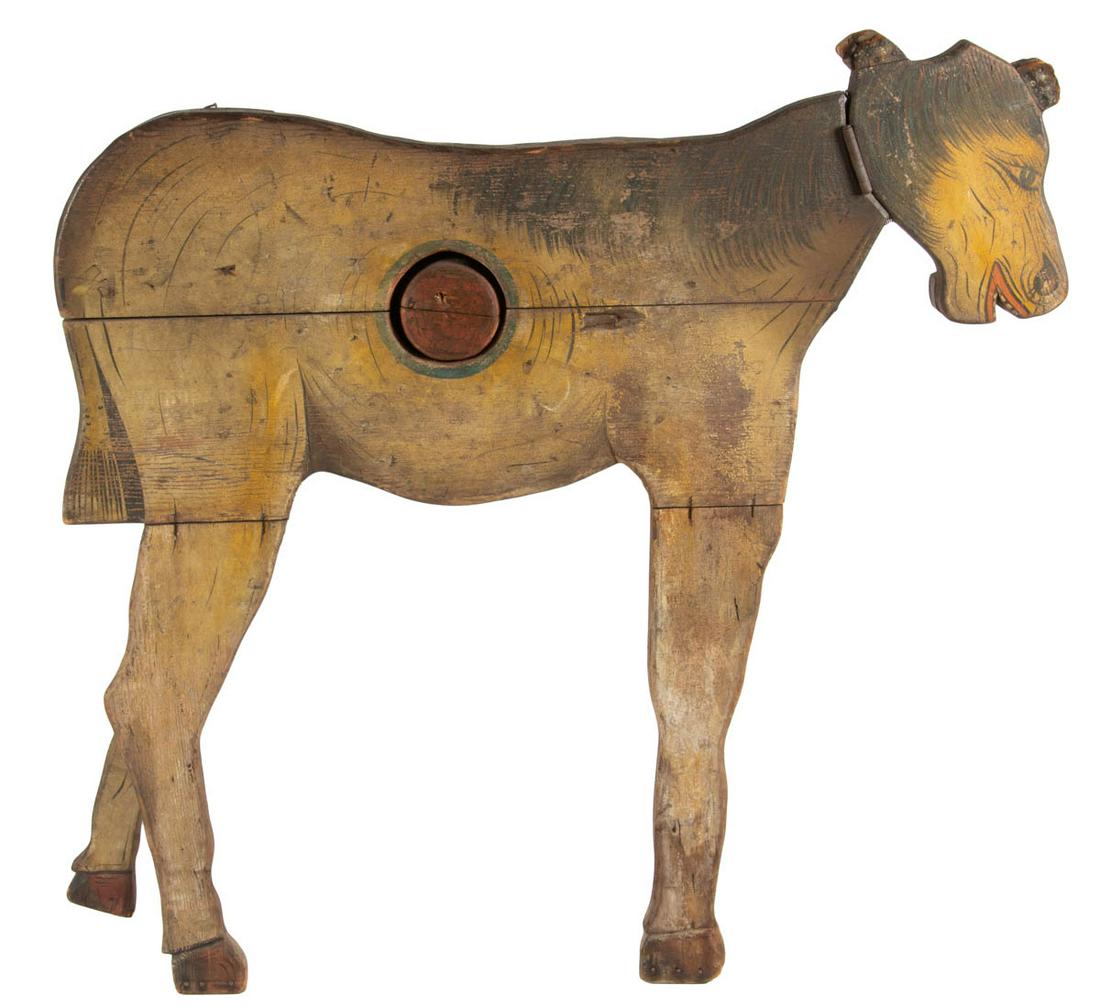 AMERICAN FOLK ART CUT-OUT AND PAINTED PINE CARNIVAL: AMERICAN FOLK ART CUT-OUT AND PAINTED PINE CARNIVAL BALL-TOSS FIGURE, depicting a nearly life-size donkey with hinged head and rear kicking leg, target mechanism to center of body. Excellent original,