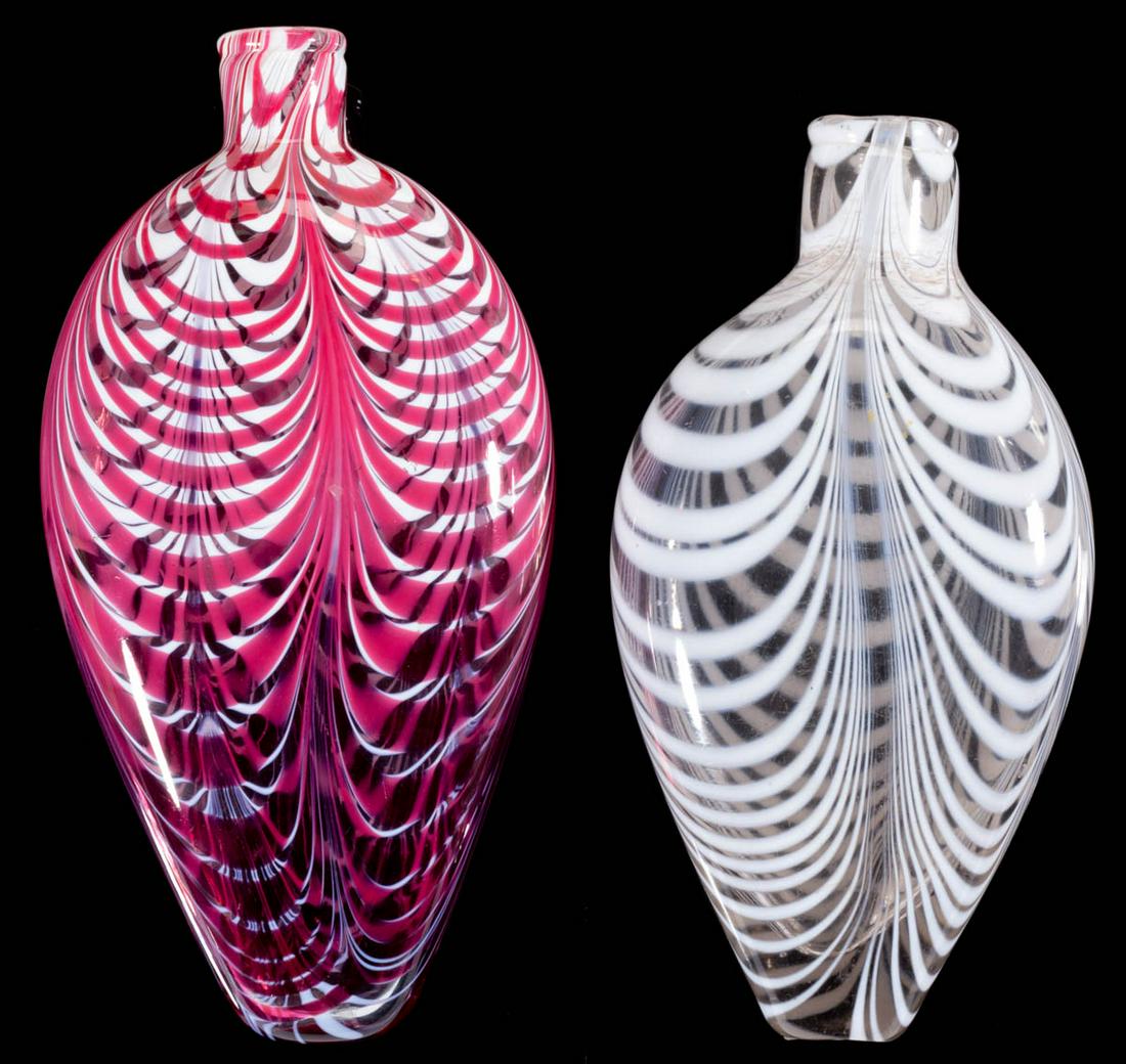 FREE-BLOWN AND MARBRIE-DECORATED FLASKS, LOT OF TWO: FREE-BLOWN AND MARBRIE-DECORATED FLASKS, LOT OF TWO, colorless, each flattened ovoid form with one having four groups of opal loopings, and one having four groupings of opal and cranberry loopings. Un