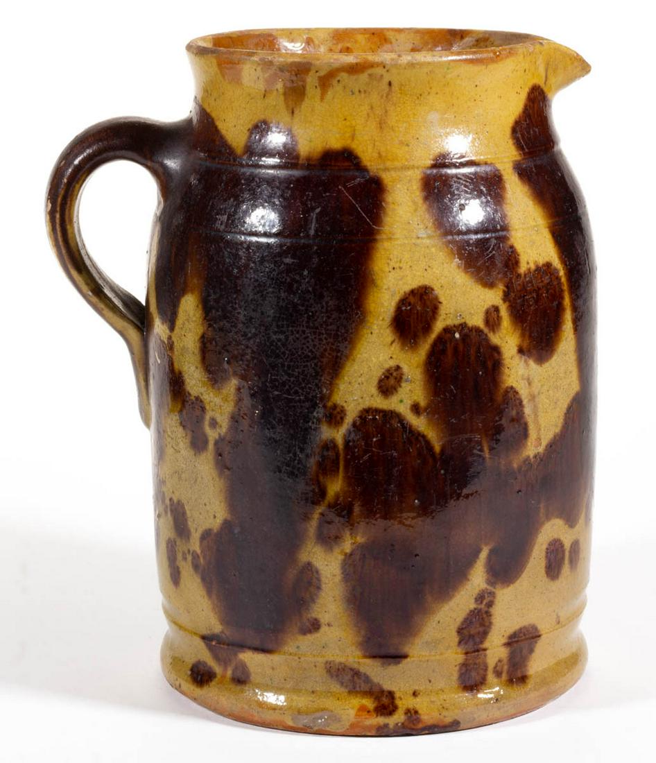 STAMPED "S. BELL & SON / STRASBURG", SHENANDOAH VALLEY: STAMPED "S. BELL & SON / STRASBURG", SHENANDOAH VALLEY OF VIRGINIA DECORATED EARTHENWARE / REDWARE PITCHER, lead- and manganese-glazed over a slip wash, approximately one-gallon capacity, cylindrical