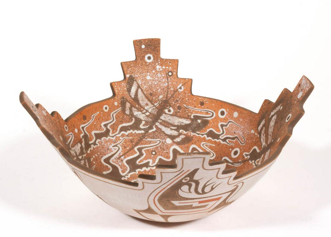 RANDY NAHOHAI (ZUNI, 1959-2016) NATIVE AMERICAN POTTERY: RANDY NAHOHAI (ZUNI, 1959-2016) NATIVE AMERICAN POTTERY CORN MEAL BOWL, cut-out rim with four stepped geometric sides merging at the well, the interior with dragonfly decoration highlighted with glitt