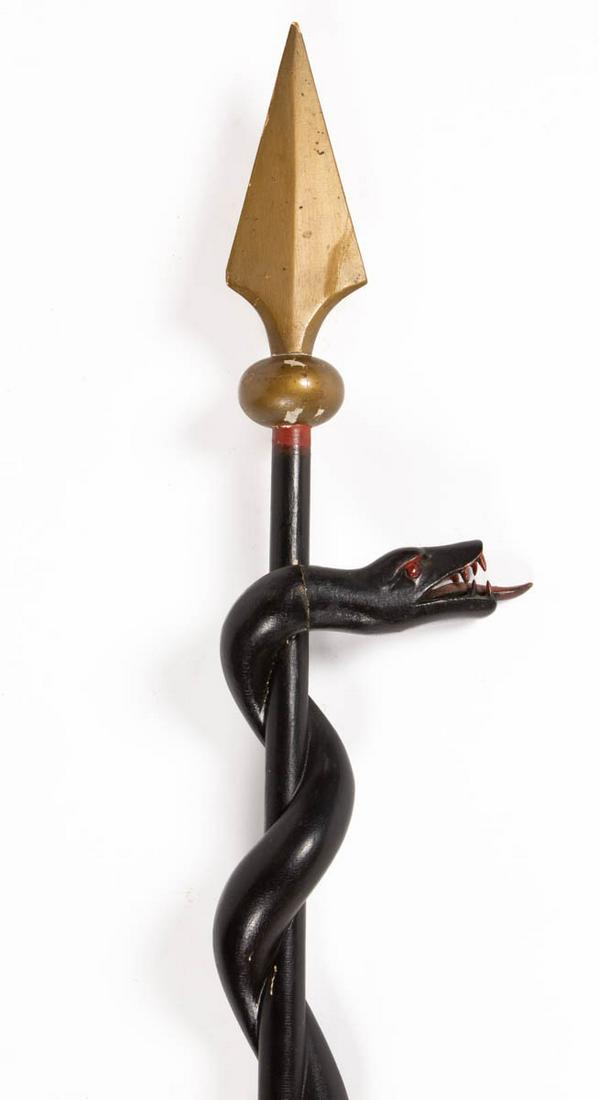 AMERICAN ODD FELLOWS / LODGE FOLK ART CARVED AND: AMERICAN ODD FELLOWS / LODGE FOLK ART CARVED AND PAINTED CEREMONIAL STAFF, featuring and intertwining serpent with red tongue going up a shaft terminating in a spear head. Retains likely original poly