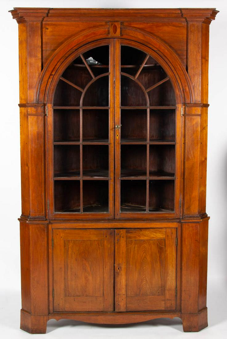 WESTERN MARYLAND INLAID WALNUT ARCHITECTURAL CORNER: WESTERN MARYLAND INLAID WALNUT ARCHITECTURAL CORNER CUPBOARD, two-piece construction, canted returns, the top case with bold, projecting molded cornice over molded door surround centering an applied k