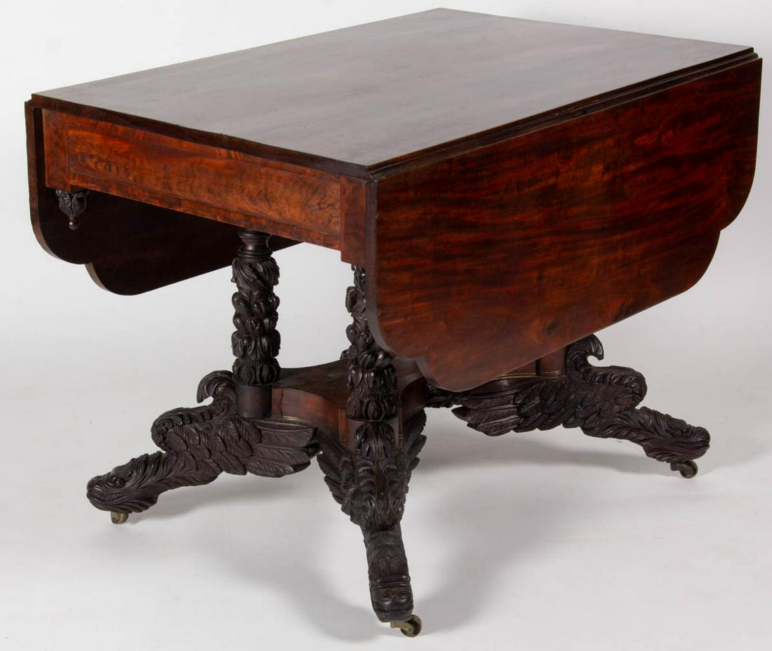 MID-ATLANTIC CLASSICAL CARVED MAHOGANY FALL-LEAF: MID-ATLANTIC CLASSICAL CARVED MAHOGANY FALL-LEAF BREAKFAST TABLE, a fine example featuring extensive carved ornamentation, the rectangular one-board top fitted with two one-board hinged fall leaves, a