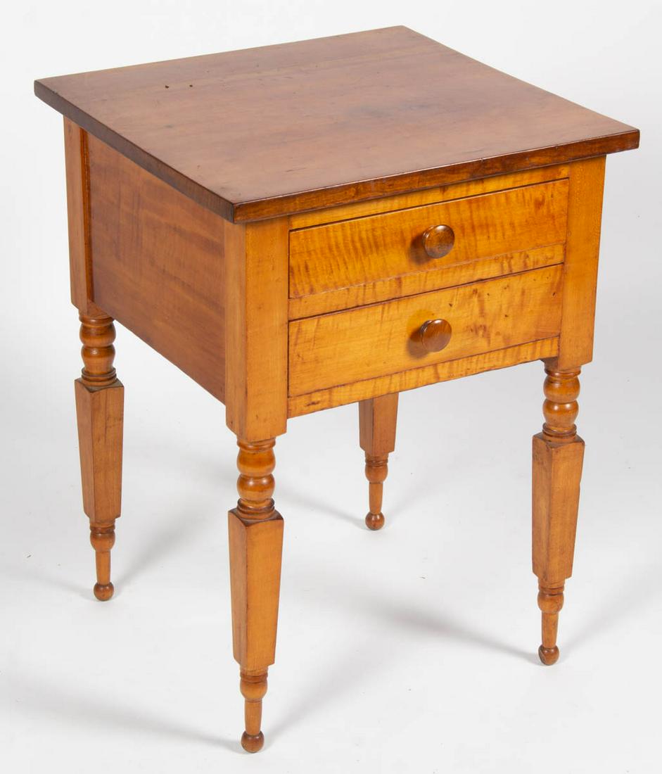 AMERICAN TIGER MAPLE STAND TABLE: AMERICAN TIGER MAPLE STAND TABLE, two-board rectangular top above two dovetailed drawers with likely original pulls raised on elaborately turned legs terminating in ball feet. Old surface with warm co