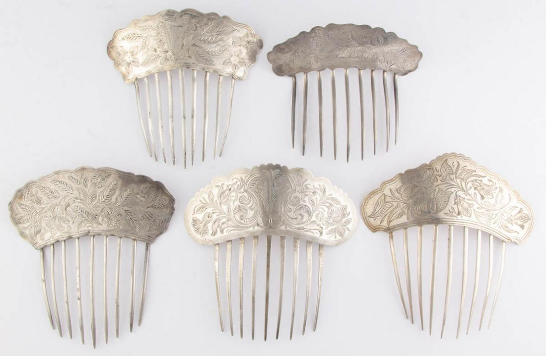 AMERICAN ENGRAVED-DECORATED SILVER HAIR COMBS, LOT OF: AMERICAN ENGRAVED-DECORATED SILVER HAIR COMBS, LOT OF FIVE, each having nine teeth attached to a shaped top with engraved floral decoration. Smallest example marked "PURE SILVER COIN", remainder unmar