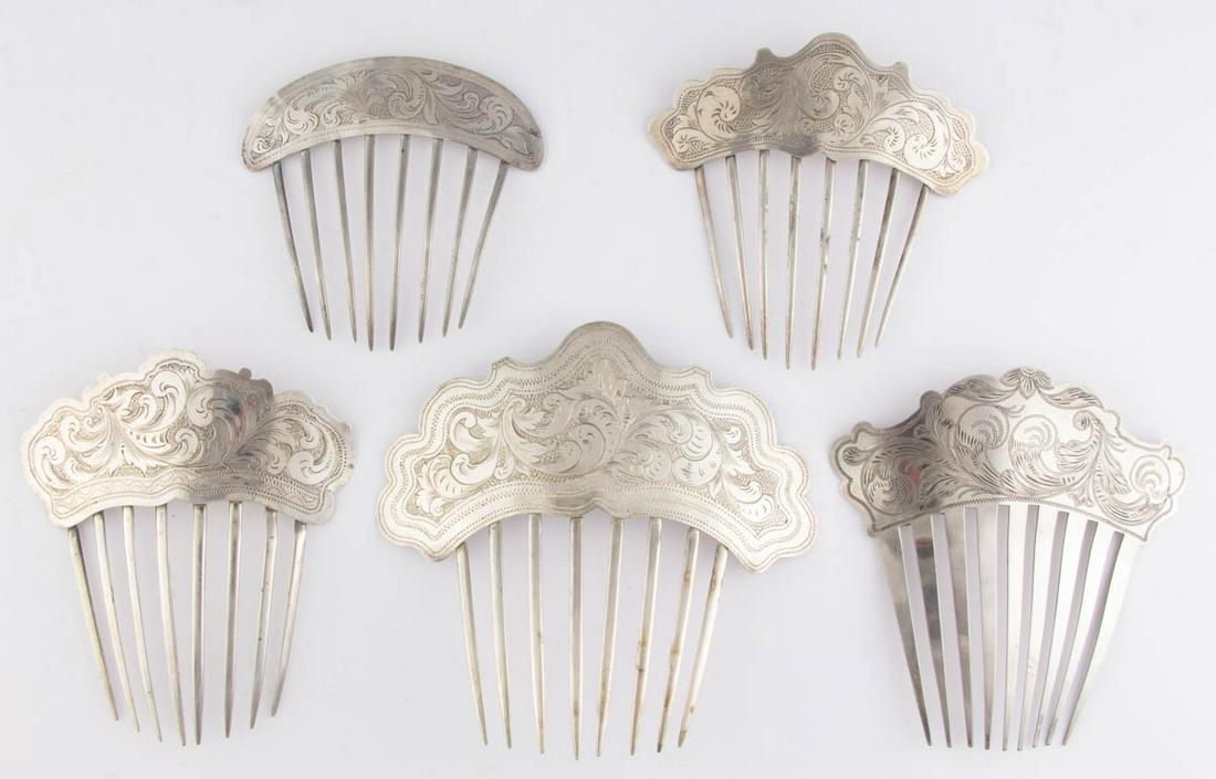 AMERICAN ENGRAVED-DECORATED SILVER HAIR COMBS, LOT OF: AMERICAN ENGRAVED-DECORATED SILVER HAIR COMBS, LOT OF FIVE, each having eight or nine teeth attached to a shaped top with engraved foliate decoration, including two with engraved initials to backs. Ea