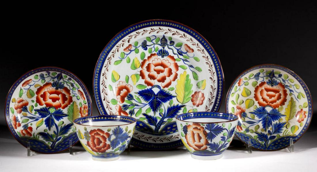 ENGLISH GAUDY DUTCH CERAMIC TEA AND TABLE ARTICLES, LOT: ENGLISH GAUDY DUTCH CERAMIC TEA AND TABLE ARTICLES, LOT OF THREE, each featuring polychrome hand-painted "Carnation" design, comprising two cup and saucer sets and an 8 1/4" D plate. One saucer retain