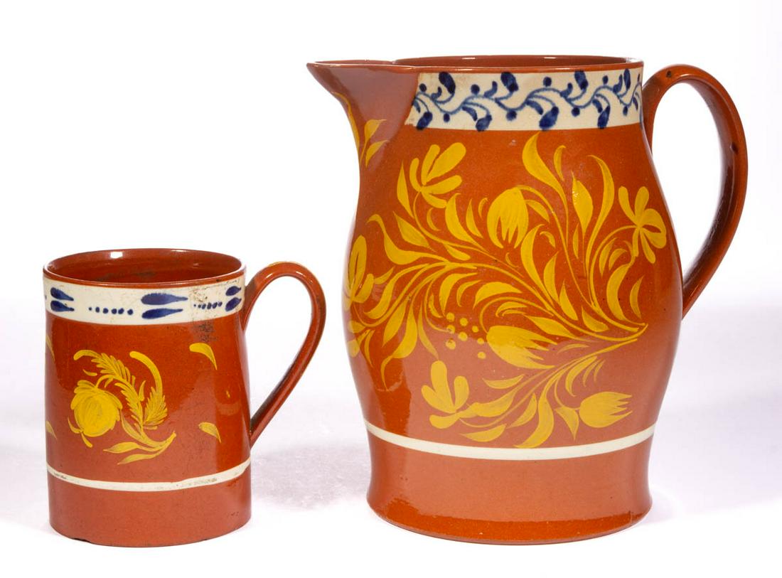 ENGLISH HAND-PAINTED REFINED EARTHENWARE / REDWARE: ENGLISH HAND-PAINTED REFINED EARTHENWARE / REDWARE DRINKING ARTICLES, LOT OF TWO, each featuring overglaze yellow hand-painted floral design with underglaze blue rim decoration on a white band, compri