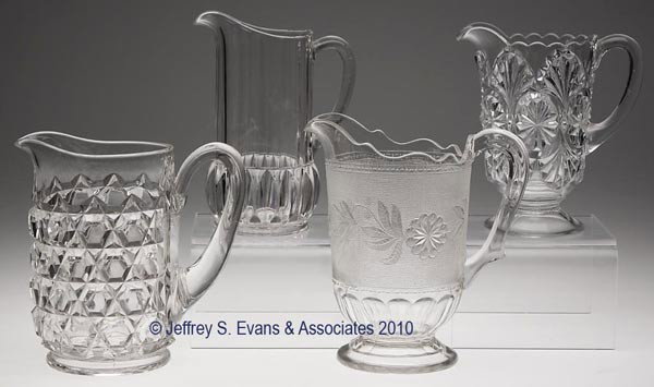 VARIOUS EAPG WATER PITCHERS, LOT OF FOUR: VARIOUS EAPG WATER PITCHERS, LOT OF FOUR, colorless, consisting of Clear Block, Cordova, Feather Duster and Stippled Dahlia. 7 3/4" to 8 5/8" h overall. Provenance: From the estate of Olive Alder.