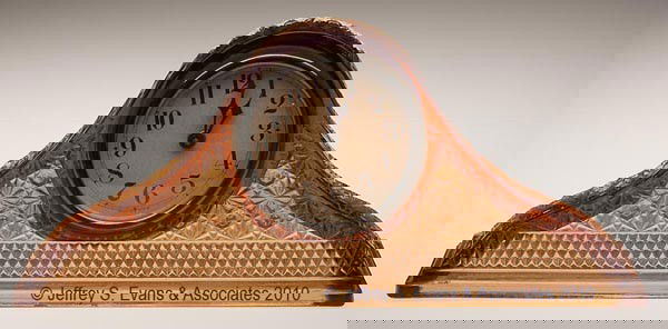 TAMBOUR ART CLOCK HUMP BACK MANTLE CLOCK: TAMBOUR ART CLOCK HUMP BACK MANTLE CLOCK, amber, Button & Daisy variant pattern case, 30-hour movement, 4" dial, unknown working condition. McKee Glass Co. 6 1/4" h, 14" wide, 4" deep. Literature: Sto