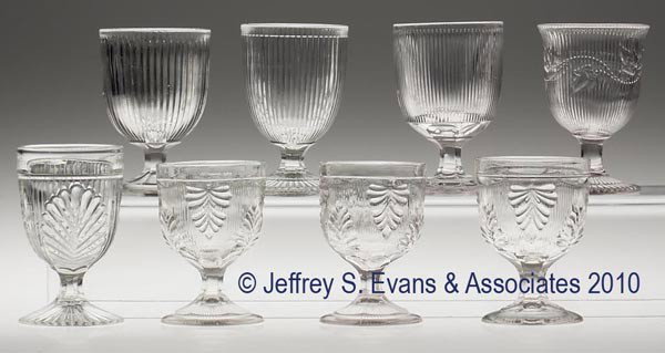 VARIOUS EAPG EGG CUPS, LOT OF EIGHT: VARIOUS EAPG EGG CUPS, LOT OF EIGHT, colorless flint, including Fine Rib and Ribbed Palm, together with six others. 3 5/8" to 3 7/8" h. Provenance: From a Vermont collection.