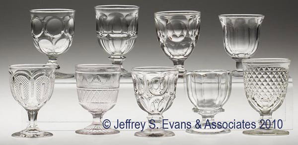 VARIOUS EAPG EGG CUPS, LOT OF NINE: VARIOUS EAPG EGG CUPS, LOT OF NINE, colorless flint, including Buckle and Hamilton, together with seven others. 3 1/4" to 3 3/4" h. Provenance: From a Vermont collection.