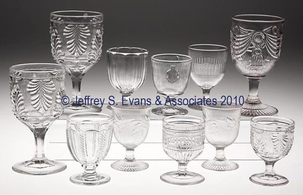 VARIOUS EAPG TABLE ARTICLES, LOT OF 11: VARIOUS EAPG TABLE ARTICLES, LOT OF 11, colorless flint, consisting of eight egg cups and three goblets. 3 3/8" to 6" h. Provenance: Property of the Sandwich Glass Museum. Being sold to benefit the ac