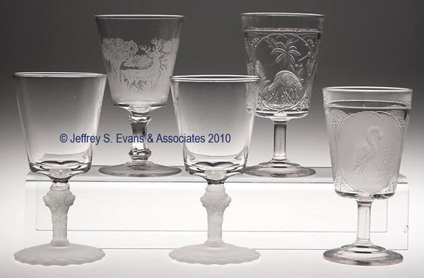 VARIOUS EAPG ANIMAL KINGDOM PATTERN GOBLETS, LOT O: VARIOUS EAPG ANIMAL KINGDOM PATTERN GOBLETS, LOT OF FIVE, colorless and some frosted, consisting of Clear and Frosted Stork, Etched Deer and Castle, and two Frosted Lion. 6" to 6 1/2" h. Prov. CatNote