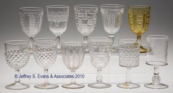 VARIOUS EAPG GOBLETS, LOT OF 11: VARIOUS EAPG GOBLETS, LOT OF 11, amber and colorless, including two Milton, Paneled Jewel, Pineapple Stem with engraved floral decoration, Queen/Pointed Panel Daisy & Button, Selby, and five others. 5
