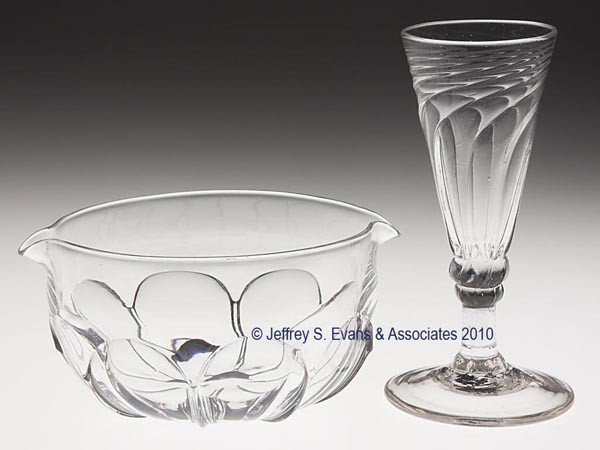 TWO PATTERN-MOLDED TABLE ARTICLES: TWO PATTERN-MOLDED TABLE ARTICLES, colorless, comprising a short ale glass with a wrythen-funnel bowl raised on two flattened knops, short stem, and a wide foot displaying a rough pontil mark, along w
