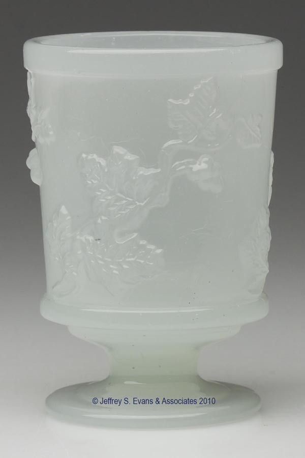 PRESSED GRAPE VINE SPOON HOLDER: PRESSED GRAPE VINE SPOON HOLDER, alabaster/clambroth, slightly tapered conical bowl with a plain rim, raised on a low single-step circular foot with a polished pontil mark. Boston & Sandwich Glass Co.