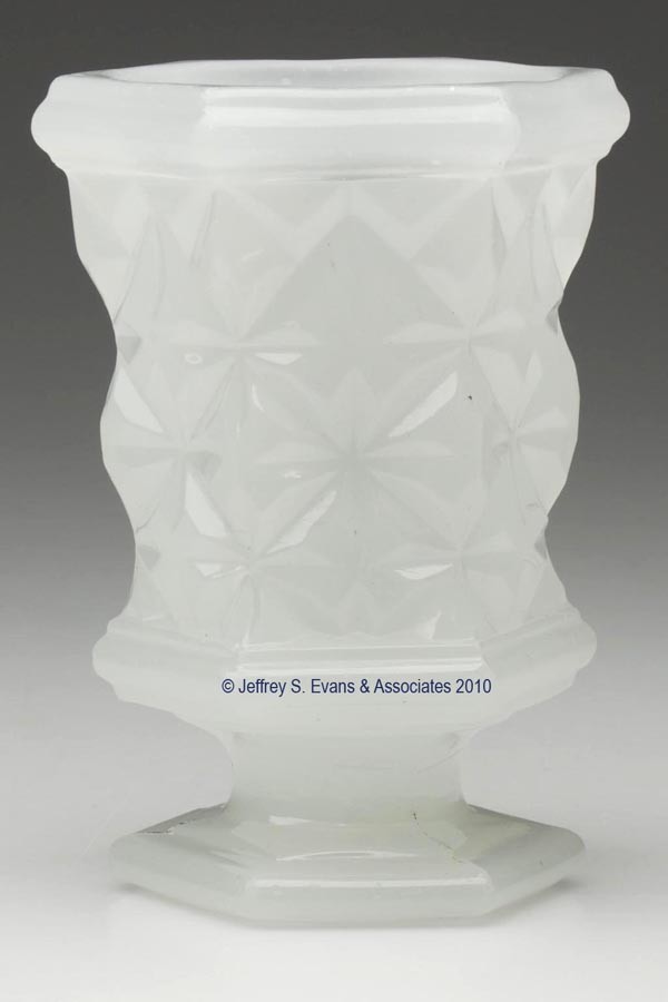 PRESSED SANDWICH STAR SPOON HOLDER: PRESSED SANDWICH STAR SPOON HOLDER, alabaster/clambroth, hexagonal bowl with a plain rim, raised on a low single-step hexagonal foot with a polished pontil mark. Boston & Sandwich Glass Co. 1845-1870.