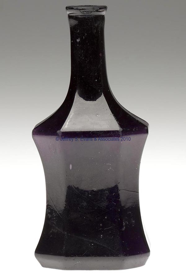 BLOWN-MOLDED PANELED COMMERCIAL COLOGNE BOTTLE: BLOWN-MOLDED PANELED COMMERCIAL COLOGNE BOTTLE, very deep amethyst, concave-sided form with eight panels, tooled lip and plain base. Boston & Sandwich Glass Co. and others. 1850-1870. 4 3/4" H, 1 1/2"