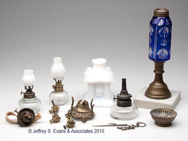 ASSORTED LIGHTING RELATED DEVICES: ASSORTED LIGHTING RELATED DEVICES, 12 pieces total, including a Fire Fly miniature lamp, two complete Olmstead burners, other burners, a 1920s cut overlay peg lamp, etc. 19th and 20th centuries. Prove