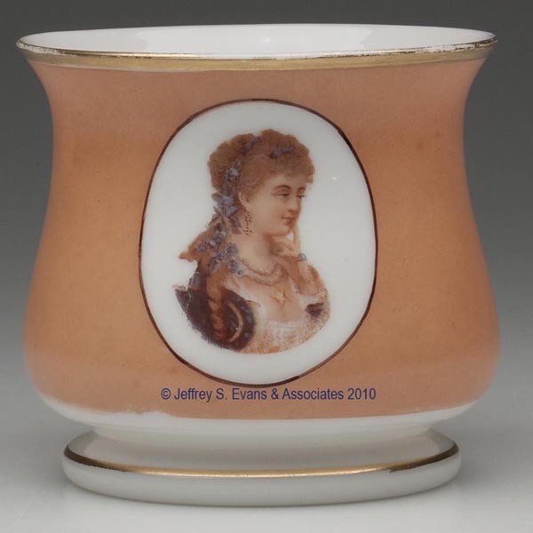 BLOWN-MOLDED DECORATED OPAL FLOWER POT: BLOWN-MOLDED DECORATED OPAL FLOWER POT, opaque white with peach-color ground and gilt rims, urn-form body with a lady-transfer decoration, raised on a low foot with a ground pontil mark. Boston & Sand