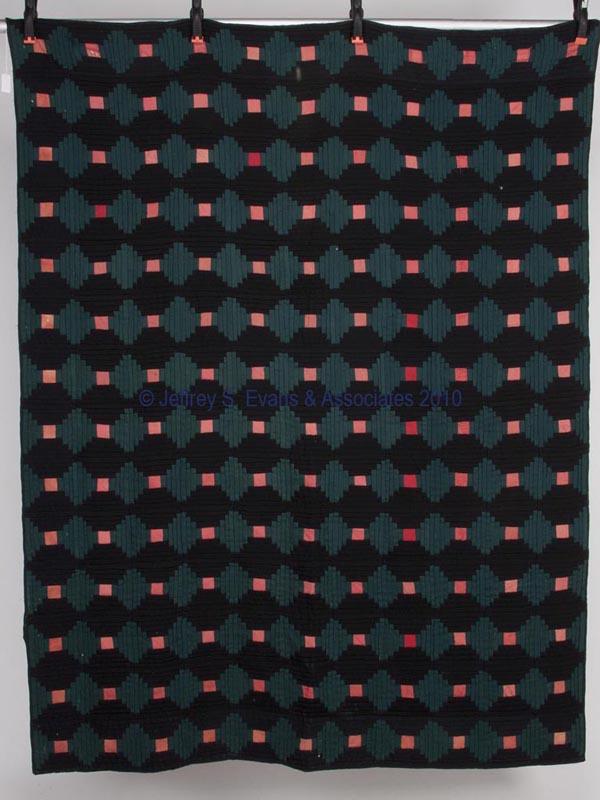 MID-ATLANTIC LOG CABIN PATTERN QUILT: MID-ATLANTIC LOG CABIN PATTERN QUILT comprising 154 green and black 6" squares with red centers, earlier fabric used for foundation, edges have been stabilized on reverse with contemporary material. F