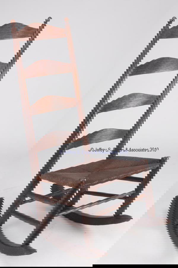 SHENANDOAH VALLEY OF VA WHITE OAK LADDER-BACK ROCK: SHENANDOAH VALLEY OF VA WHITE OAK LADDER-BACK ROCKER tall four-slat back with finely turned ovoid post finials, later woven-rush seat. Probably Augusta County. First half 19th century. 42 1/2" HOA. Pr