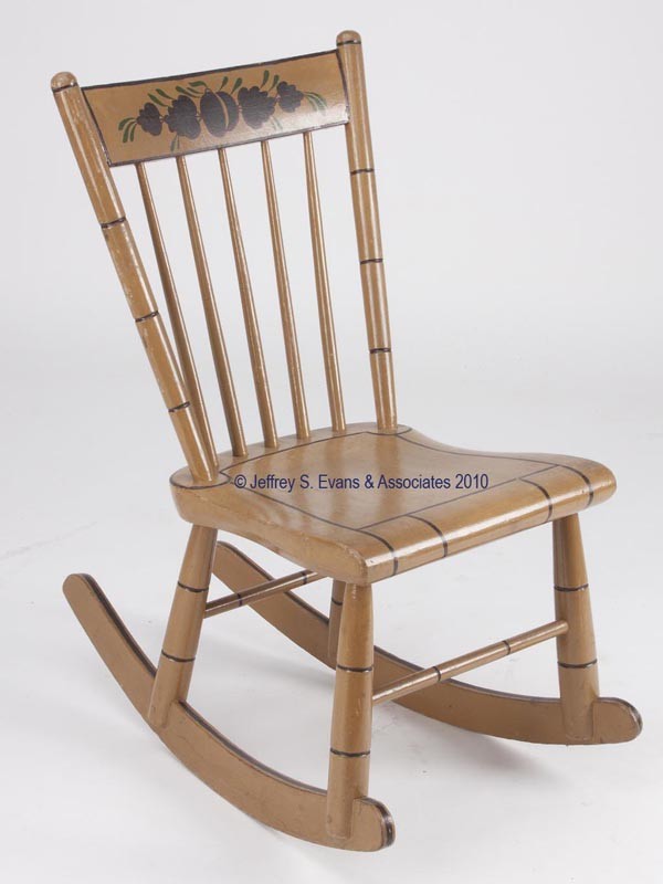 PENNSYLVANIA PAINT-DECORATED DIMINUTIVE PLANK-BOTT: PENNSYLVANIA PAINT-DECORATED DIMINUTIVE PLANK-BOTTOM ROCKER five-spindle back and shaped seat. Paint and decoration possibly original. Second half 19th century. 30 1/2" HOA, 14 1/2" H seat. Provenance