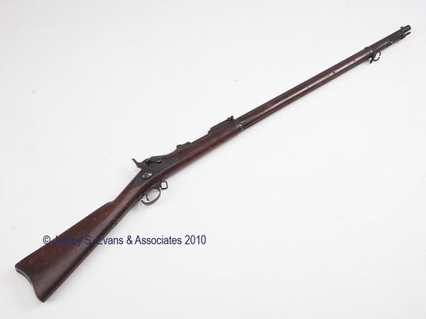 MODEL 1884 U.S. "TRAPDOOR" RIFLE: MODEL 1884 U.S. "TRAPDOOR" RIFLE marked with eagle and "US /SPRINGFIELD" on lock forward of hammer, and "US / MODEL / 1884" on breechblock, inspector markings on stock, steel ramrod, three slings. ser