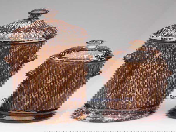 BENNINGTON ROCKINGHAM-GLAZE POTTERY TOBACCO JARS,: BENNINGTON ROCKINGHAM-GLAZE POTTERY TOBACCO JARS, LOT OF TWO mottled brown glaze, Alternate Rib pattern, each with barely-discernible impressed Type A mark, smaller example with mis-matched cover. Lym