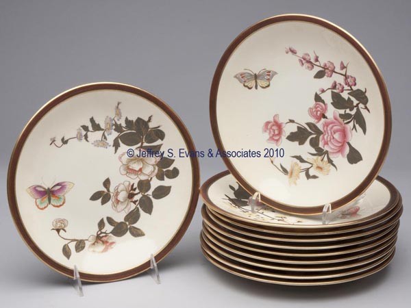 ROYAL WORCHESTER BOTANICAL PLATES, SET OF ELEVEN: ROYAL WORCHESTER BOTANICAL PLATES, SET OF ELEVEN polychrome and gilt decoration, each featuring a different floral spray and butterfly, 1/4" brown border, reverse with the Worcester mark overglaze, th