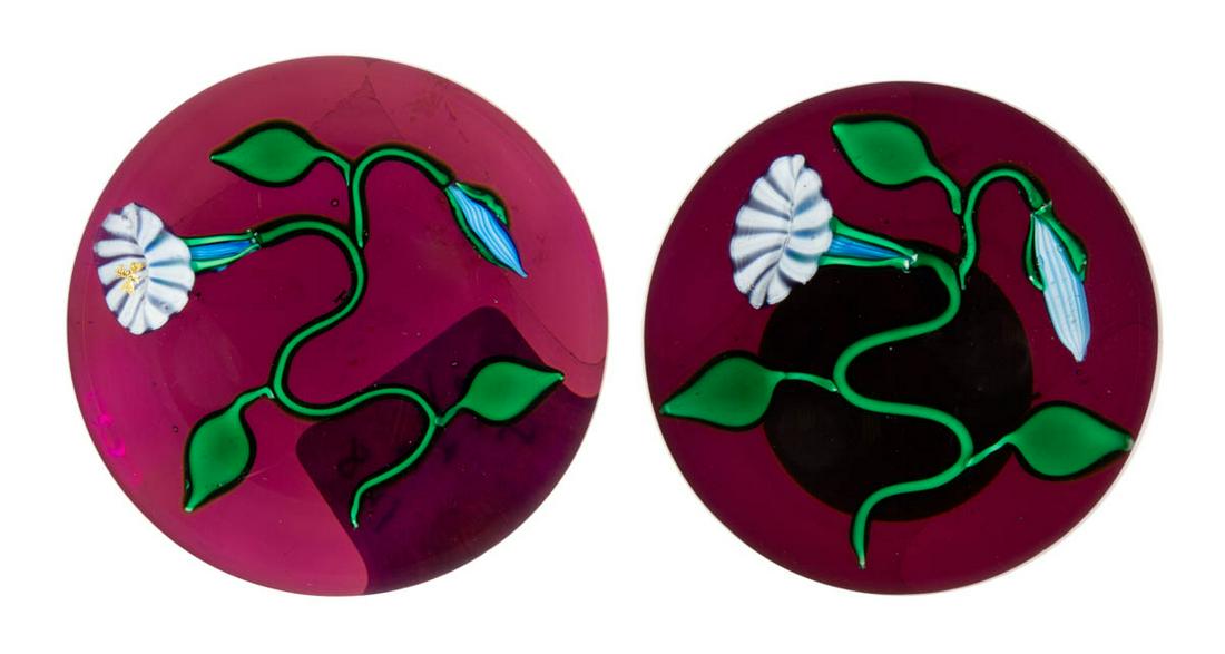 CHARLES KAZIUN JR. (AMERICAN, 1919-1992) MORNING GLORY: CHARLES KAZIUN JR. (AMERICAN, 1919-1992) MORNING GLORY LAMPWORK STUDIO ART GLASS NEAR PAIR OF MINIATURE PAPERWEIGHTS, each having a single blue and white morning glory blossom, connected to a curling 