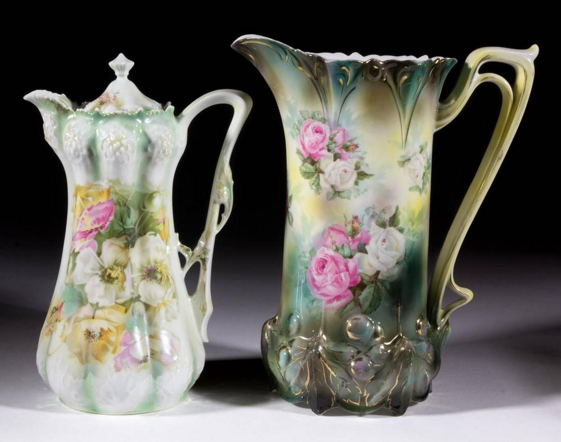 R.S. PRUSSIA FLORAL MOTIF PORCELAIN DRINKING ARTICLES,: R.S. PRUSSIA FLORAL MOTIF PORCELAIN DRINKING ARTICLES, LOT OF TWO, comprising a chocolate pot with polychrome poppy design having molded oak leaves to bottom and berry-like mold to top, and a pitcher 