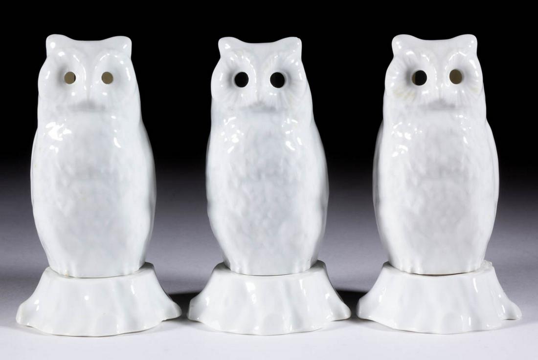 R.S. GERMANY PORCELAIN OWL FIGURAL NURSERY LAMPS /: R.S. GERMANY PORCELAIN OWL FIGURAL NURSERY LAMPS / LIGHTS, LOT OF THREE, each having two parts including a molded stump base and a sitting bird of prey with open eye sockets and vent to back. Marks to