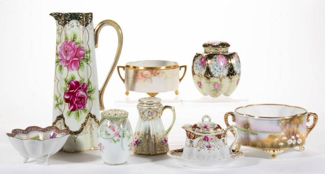 JAPANESE NIPPON HAND-PAINTED FLORAL MOTIF PORCELAIN: JAPANESE NIPPON HAND-PAINTED FLORAL MOTIF PORCELAIN ARTICLES, LOT OF NINE, including a rose-decorated tankard pitcher, two four-footed quatrefoil bowls including one with vertical handles featuring be