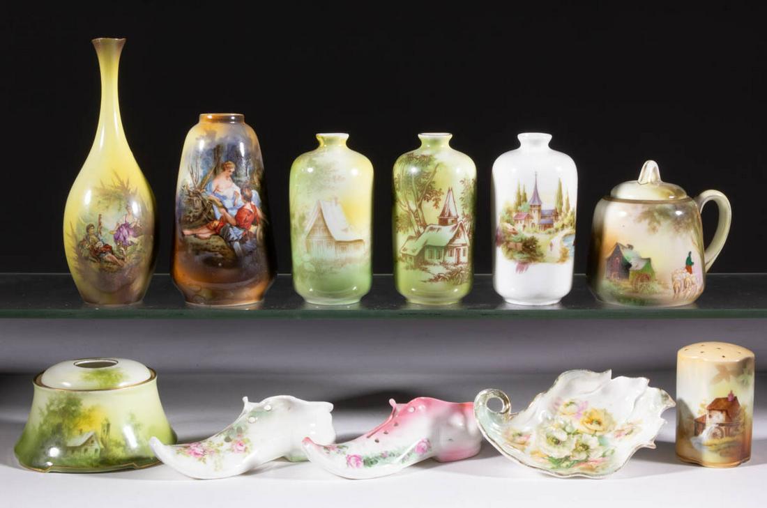 R.S. GERMANY AND RELATED PORCELAIN ARTICLES, LOT OF 11: R.S. GERMANY AND RELATED PORCELAIN ARTICLES, LOT OF 11, comprising five bud vases including two featuring scenes with romantic couples, a hair receiver, two figural shoes, a shaker featuring a mill sc
