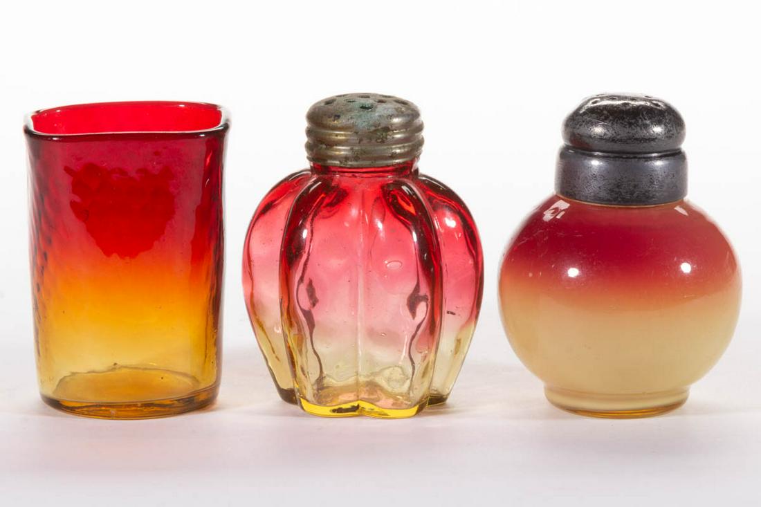 ASSORTED AMBERINA / PEACHBLOW GLASS ARTICLES, LOT OF: ASSORTED AMBERINA / PEACHBLOW GLASS ARTICLES, LOT OF THREE, comprising a six-lobe salt shaker, a Hobbs Coral salt shaker, and a Diamond-Quilt toothpick holder. Various makers. Fourth quarter 19th cent