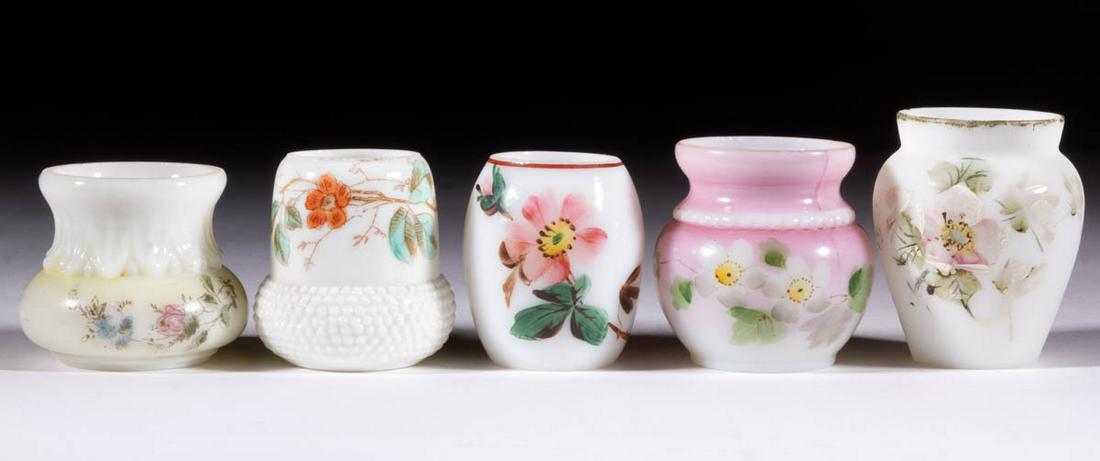ASSORTED DECORATED OPAL GLASS TOOTHPICK HOLDERS, LOT OF: ASSORTED DECORATED OPAL GLASS TOOTHPICK HOLDERS, LOT OF FIVE, opaque white with polychrome-enamel decoration, including an urn form with floral decoration, a Wave Crest example with stenciled floral d