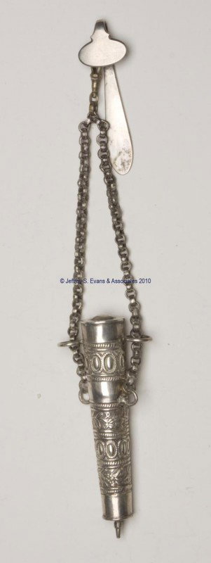 CONTINENTAL SILVER WAIST CHATELAINE WITH SPOOL HOLD: CONTINENTAL SILVER WAIST CHATELAINE WITH SPOOL HOLDER, unmarked clip with double chains suspending a bead and berry embossed cylinder-form case, removable cap containing two loops for chain, interior 