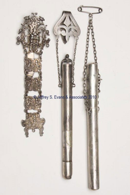 ENGLISH SILVER CHATELAINE ARTICLES, LOT OF THREE: ENGLISH SILVER CHATELAINE ARTICLES, LOT OF THREE, consisting of two cylinder-form crochet needle cases, one suspended by a fleur-de-lis-form clip and hinged lid, and a J. M. Banks figural hinged clip