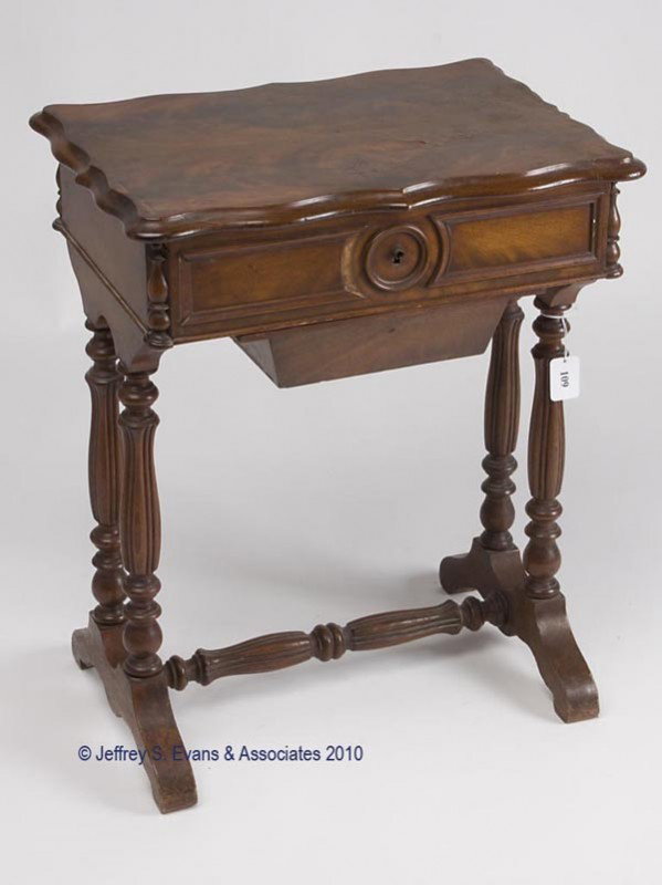 VICTORIAN WALNUT SEWING WORK TABLE: VICTORIAN WALNUT SEWING WORK TABLE, reeded stretcher base with four scroll feet supporting a rectangular-form work box, underside fitted with a drawer. The scallop-edge hinged top opens to reveal a mi