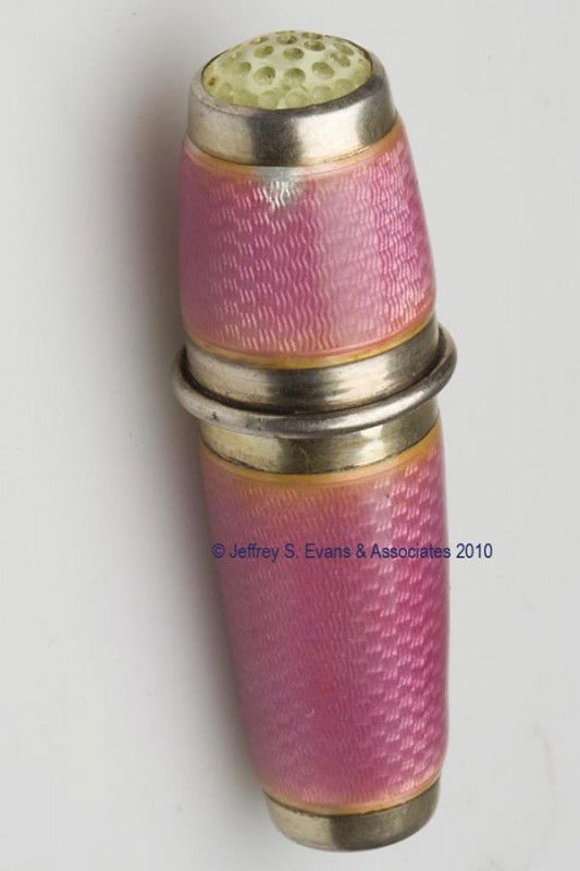 GERMAN ENAMEL ON STERLING SILVER SEWING KIT: GERMAN ENAMEL ON STERLING SILVER SEWING KIT, pink guilloche' decoration and colorless stone cap, threaded thimble reveals an interior fitted with a cylinder for needles and containing a pair of scisso