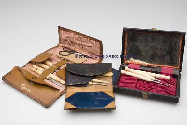LEATHER FITTED SEWING KITS WITH BONE / IVORY NEEDL: LEATHER FITTED SEWING KITS WITH BONE / IVORY NEEDLEWORKING TOOLS, LOT OF THREE, rectangular forms, consisting of a black leather covered wooden box, interior lid with mirror and lined in burgundy silk