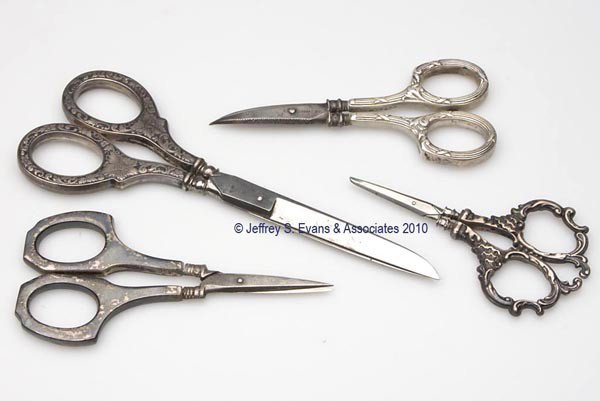 AMERICAN STERLING SILVER SCISSORS, LOT OF FOUR: AMERICAN STERLING SILVER SCISSORS, LOT OF FOUR, consisting of three pair Gorham embroidery examples, two with scroll embossing, one having curved blades, and an unpatterned example; and a Webster exam